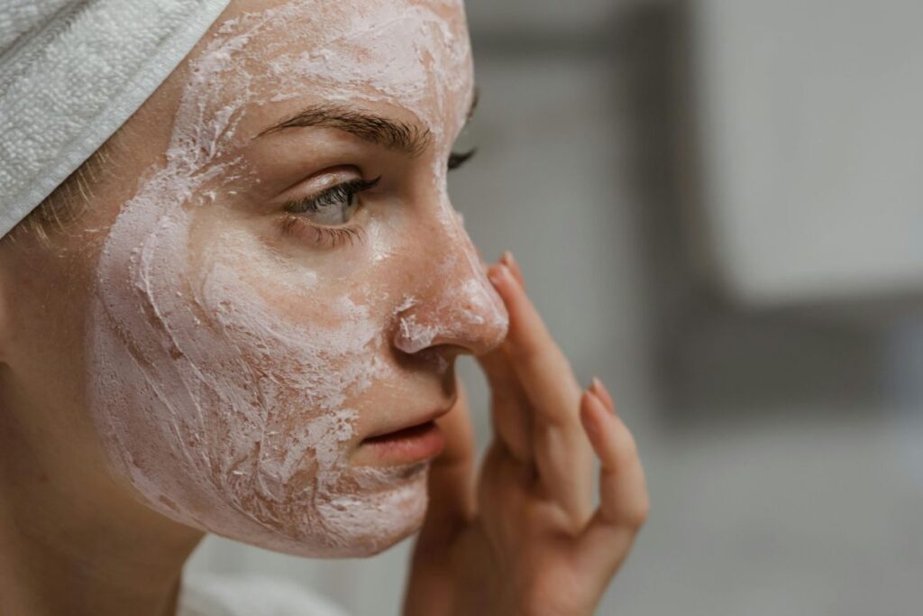 Woman demonstrating proper facial cleansing technique for sensitive skin