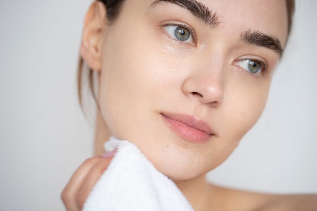 Woman following skincare routine to maintain healthy skin during stressful times
